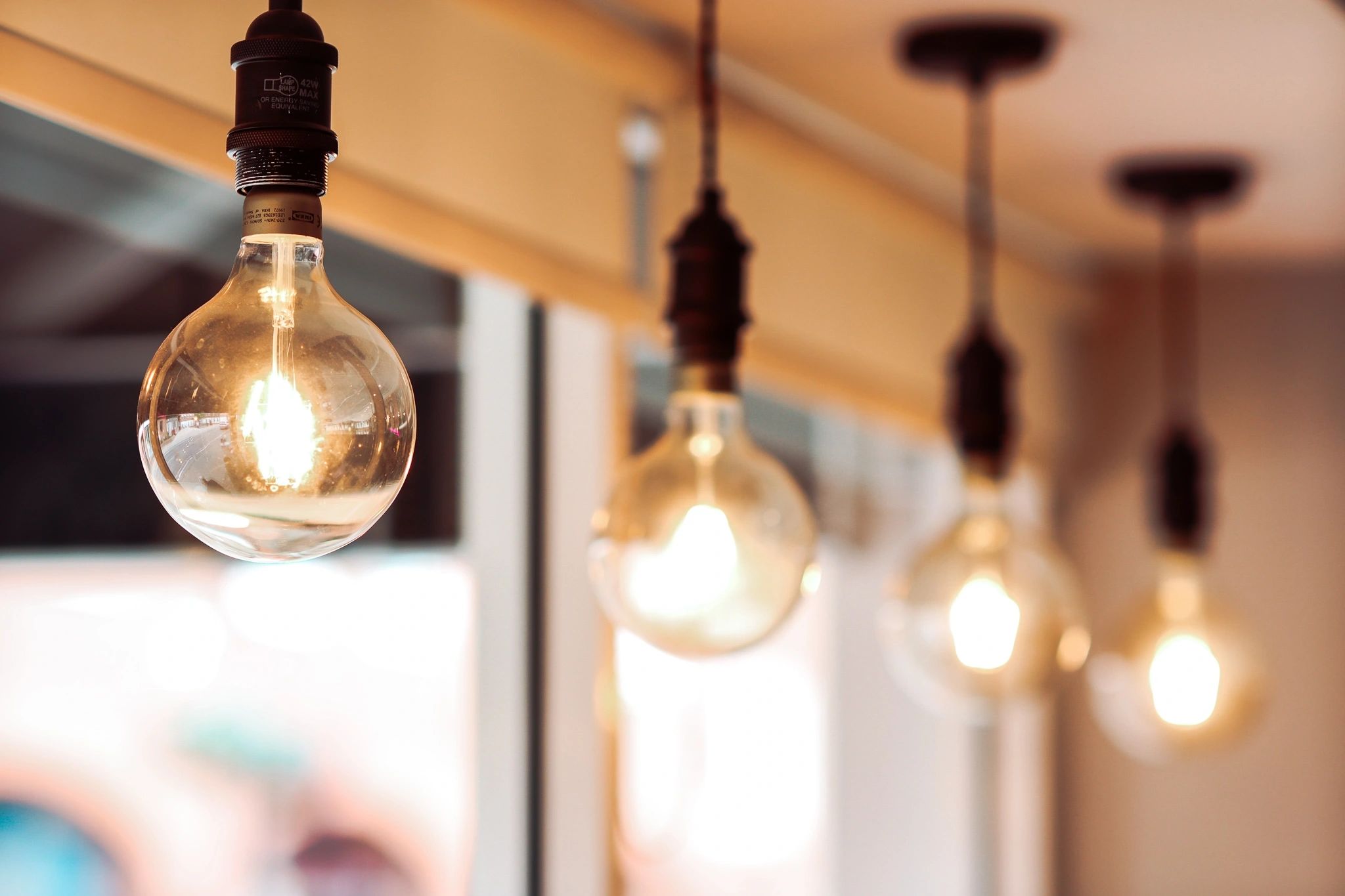 Warm filament bulbs in the window of Two Sisters