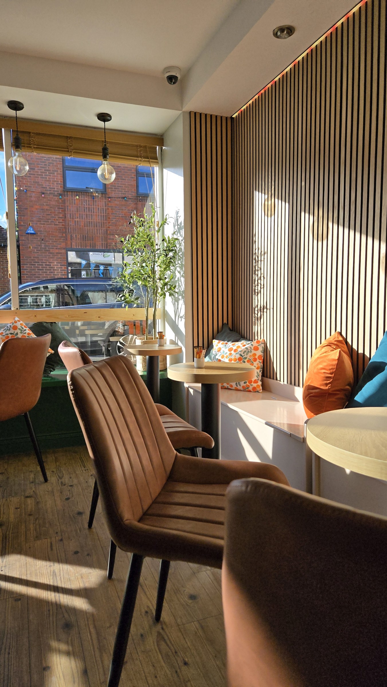 The window seats at Two Sisters in the afternoon sun